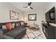 Cozy living room with plush seating, modern decor, and a large TV at 19204 Weymouth Dr, Land O Lakes, FL 34638
