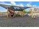 Community playground offering play structures and a covered play area for hours of fun in the sun at 19204 Weymouth Dr, Land O Lakes, FL 34638