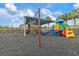 Community playground featuring swings, slides, and plenty of room for the to run around and play at 19204 Weymouth Dr, Land O Lakes, FL 34638