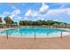 Beautiful community pool with a brick surround, stainless steel rails, and plenty of room for fun in the sun at 19204 Weymouth Dr, Land O Lakes, FL 34638