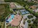 Aerial view of a community that features a pool, tennis courts, clubhouse, and playground at 20025 Callisto Hill Pl, Tampa, FL 33647