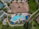 Bird's-eye view of pool and clubhouse area with tennis and bocce ball courts at 20025 Callisto Hill Pl, Tampa, FL 33647
