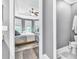 View from bedroom to main bathroom, featuring neutral colors and flooring at 20025 Callisto Hill Pl, Tampa, FL 33647