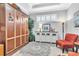 Stylish bedroom featuring a murphy bed and decorative rug, offering a flexible living space at 20025 Callisto Hill Pl, Tampa, FL 33647