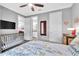 Multi-purpose bedroom with a crib and easy access to a private bathroom at 20025 Callisto Hill Pl, Tampa, FL 33647