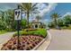 Beautiful community entrance with tropical landscaping and decorative signage at 20025 Callisto Hill Pl, Tampa, FL 33647