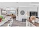 Open floor plan featuring a kitchen island, hardwood floors and modern fixtures at 20025 Callisto Hill Pl, Tampa, FL 33647
