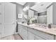 Main bathroom boasts double sinks, granite counters, and a glass enclosed shower at 20025 Callisto Hill Pl, Tampa, FL 33647