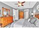 Spacious main bedroom with wood furniture and a view to the living area at 20025 Callisto Hill Pl, Tampa, FL 33647