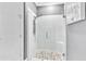 Modern shower with glass door, rainfall shower head, and tiled walls and flooring at 20025 Callisto Hill Pl, Tampa, FL 33647