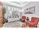 Cozy sitting room decorated with soft neutral colors and furnishings; features a large window at 20025 Callisto Hill Pl, Tampa, FL 33647