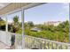 Inviting screened balcony features panoramic views of the waterway, lush greenery, and waterfront residences at 204 Haven Beach Ct, Indian Rocks Beach, FL 33785