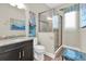 Stylish bathroom with a walk-in shower and modern fixtures at 204 Haven Beach Ct, Indian Rocks Beach, FL 33785