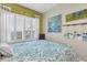 Bright bedroom with ample natural light and serene decor at 204 Haven Beach Ct, Indian Rocks Beach, FL 33785