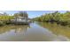 Waterfront view of boat dock with boat and lift in place on the waterway at 204 Haven Beach Ct, Indian Rocks Beach, FL 33785