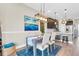 Open concept dining area with stylish light fixture, decor, and seamless flow to the modern kitchen at 204 Haven Beach Ct, Indian Rocks Beach, FL 33785