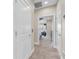 Bright hallway with carpet and doors leading to rooms, showcasing the home's open layout at 204 Haven Beach Ct, Indian Rocks Beach, FL 33785