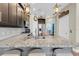 Modern kitchen with a breakfast bar, granite countertops, and stainless steel appliances at 204 Haven Beach Ct, Indian Rocks Beach, FL 33785