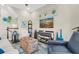 Cozy living area showcasing stylish decor, comfortable seating, and staircase at 204 Haven Beach Ct, Indian Rocks Beach, FL 33785