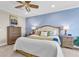 Serene main bedroom with calming decor, a ceiling fan, and well-appointed furnishings for relaxation at 204 Haven Beach Ct, Indian Rocks Beach, FL 33785