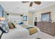 Inviting main bedroom with view of a dresser with a mirror and a glimpse into an attached bathroom at 204 Haven Beach Ct, Indian Rocks Beach, FL 33785