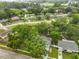 Gorgeous aerial view of a neighborhood featuring mature trees and well-maintained properties at 215 Claire Dr, Seffner, FL 33584