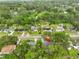 Captivating aerial view showcasing the property's location and surrounding lush greenery of the neighborhood at 215 Claire Dr, Seffner, FL 33584