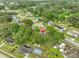 Stunning aerial view highlighting the property, swimming pool, and proximity to surrounding community amenities at 215 Claire Dr, Seffner, FL 33584