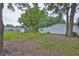 Expansive backyard featuring ample space and mature trees, perfect for outdoor activities at 215 Claire Dr, Seffner, FL 33584