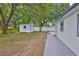 The spacious backyard includes a patio, storage shed, and grassy areas at 215 Claire Dr, Seffner, FL 33584