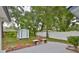 Spacious backyard featuring a brick barbecue, storage shed and new white vinyl fence for added privacy at 215 Claire Dr, Seffner, FL 33584