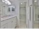 Bathroom with granite countertop vanity and tiled shower at 215 Claire Dr, Seffner, FL 33584