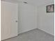 Bedroom with light gray carpet, door, and a picture on the wall at 215 Claire Dr, Seffner, FL 33584