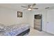 This cozy bedroom has a ceiling fan and a dresser with television at 215 Claire Dr, Seffner, FL 33584