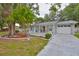 Charming single-story home features brick facade, well-manicured lawn, and a welcoming front porch at 215 Claire Dr, Seffner, FL 33584