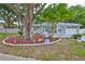 Charming single-story home features brick facade, well-manicured lawn, and a welcoming front porch at 215 Claire Dr, Seffner, FL 33584