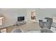 Inviting living room with stylish decor and a seamless flow into the adjacent dining area at 215 Claire Dr, Seffner, FL 33584