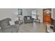Comfortable living room with wood flooring and modern furniture with great natural light at 215 Claire Dr, Seffner, FL 33584