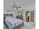 Main bedroom with closet and French doors to the dining area at 215 Claire Dr, Seffner, FL 33584