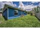 Exterior rear of the property with yard and access to the back door at 2307 N 47Th St, Tampa, FL 33605