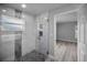 Modern bathroom features a glass enclosed shower with gorgeous marble tiling at 2307 N 47Th St, Tampa, FL 33605
