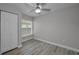 Bright bedroom features a ceiling fan, a window, and a closet at 2307 N 47Th St, Tampa, FL 33605