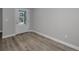 Bright entryway featuring wood-look flooring, a white door and neutral paint at 2307 N 47Th St, Tampa, FL 33605