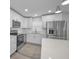 Bright kitchen featuring stainless steel appliances, white cabinets and subway tile backsplash at 2307 N 47Th St, Tampa, FL 33605