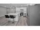 Open kitchen featuring stainless steel appliances, a quartz island, and bar stool seating at 2307 N 47Th St, Tampa, FL 33605
