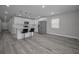 Modern kitchen boasts stainless appliances, white cabinets and a large center island with seating at 2307 N 47Th St, Tampa, FL 33605