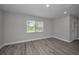 This cozy living room is painted in gray and features durable gray wood-look flooring at 2307 N 47Th St, Tampa, FL 33605
