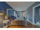Bright bedroom with hardwood floors, a four-poster bed, and natural light streaming through the windows at 2412 Burlington N Ave, St Petersburg, FL 33713