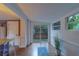 Bright dining area with hardwood floors, large windows and sliding glass door to hot tub at 2412 Burlington N Ave, St Petersburg, FL 33713