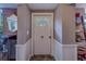 Bright foyer with a white front door featuring decorative glass, accented by a stylish mirror and decor at 2412 Burlington N Ave, St Petersburg, FL 33713